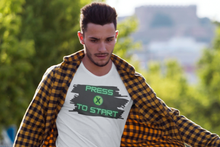 Load image into Gallery viewer, Get your game on by wearing this cool console gaming inspired T-shirt.  "Press X to Start" the game in this comfortable tee.  This updated unisex essential fits like one of your well-loved favorite tees. Super soft cotton and excellent quality print makes this tee the one you'll reach for again and again.